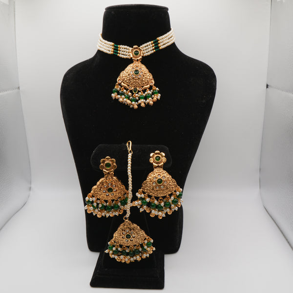 Mahira Emerald Pearl-Strand Set — gold plated pearl strand choker with triangular temple pendant with emerald stones, matching chandbali earrings and triangular maang tikka