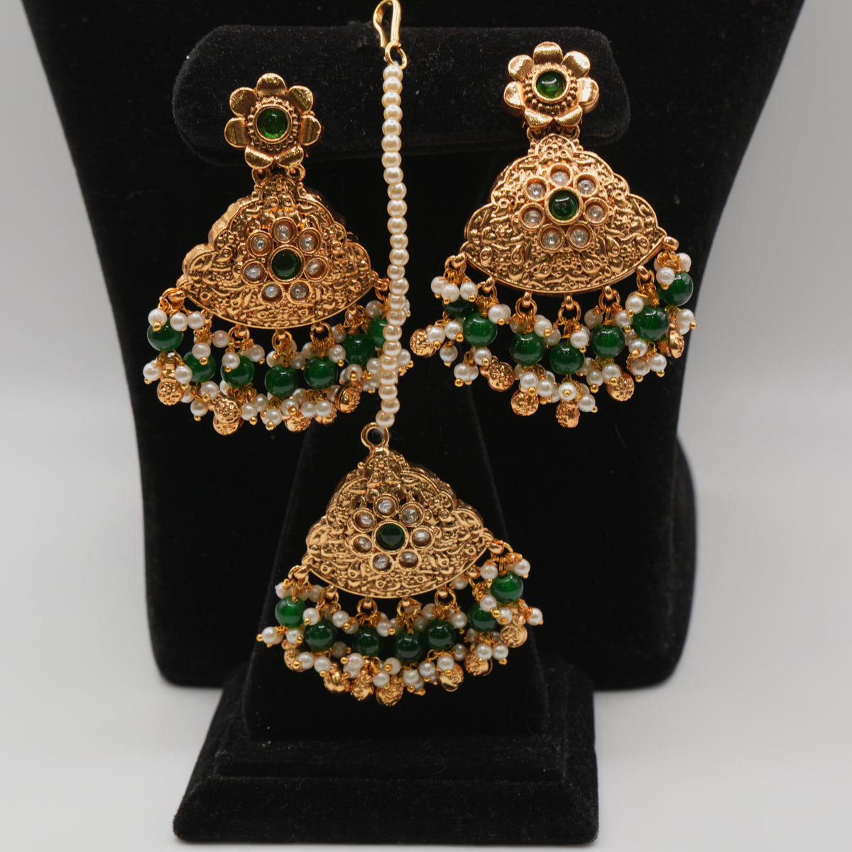 Mahira Emerald Pearl-Strand Set — gold plated pearl strand choker with triangular temple pendant with emerald stones, matching chandbali earrings and triangular maang tikka