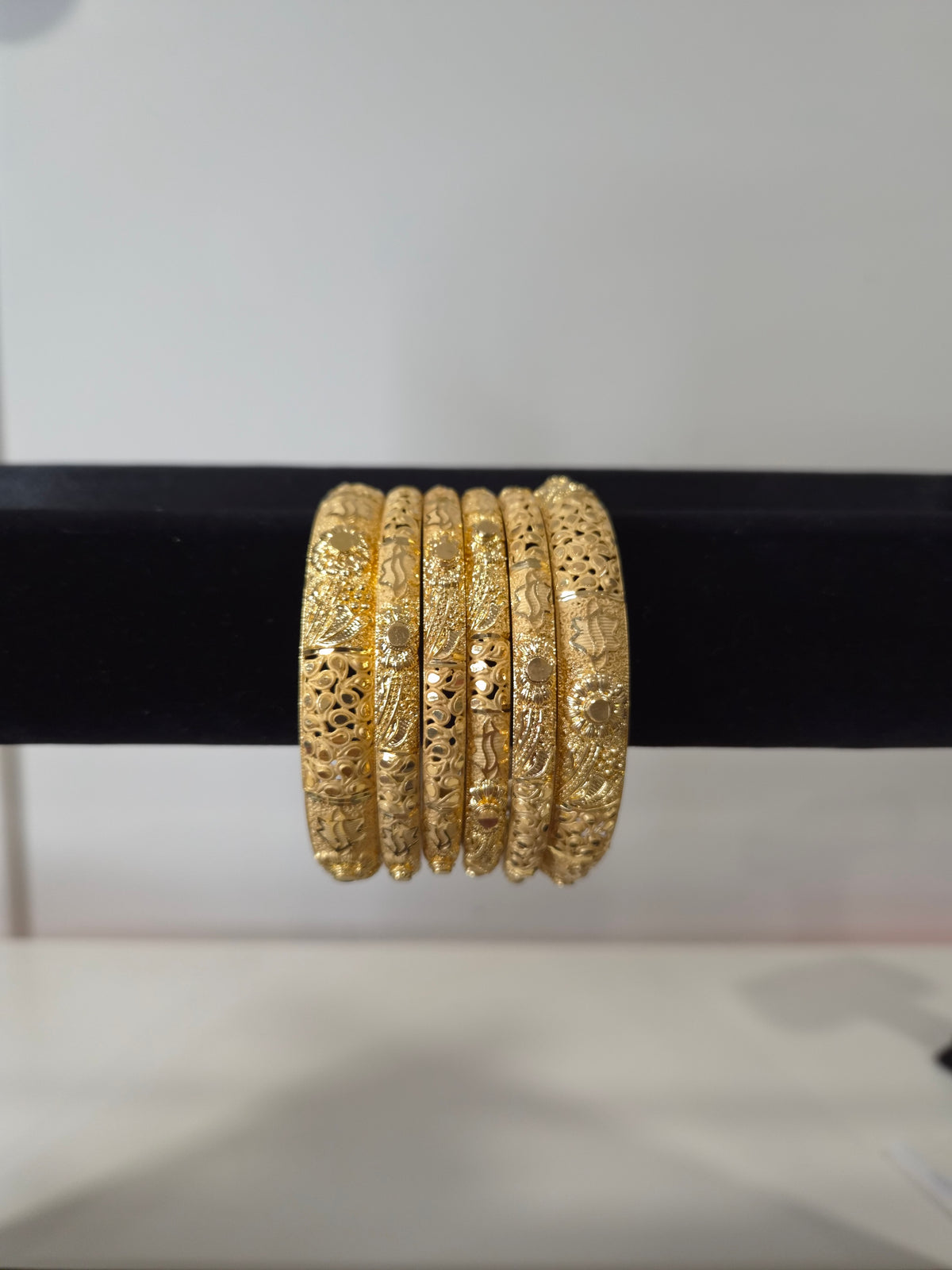 Mehraab Sunflower Filigree Kada Set — set of 6 thick gold kada bangles with sculptural sunflower motifs and deep filigree cut-work