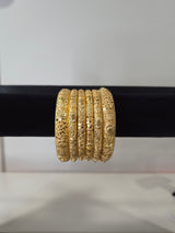 Mehraab Sunflower Filigree Kada Set — set of 6 thick gold kada bangles with sculptural sunflower motifs and deep filigree cut-work