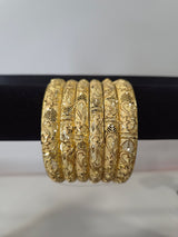 Nakshi Paisley Engraved Kada Set — set of 6 gold kada bangles with hand-engraved floral and paisley motifs and diamond-cut detailing