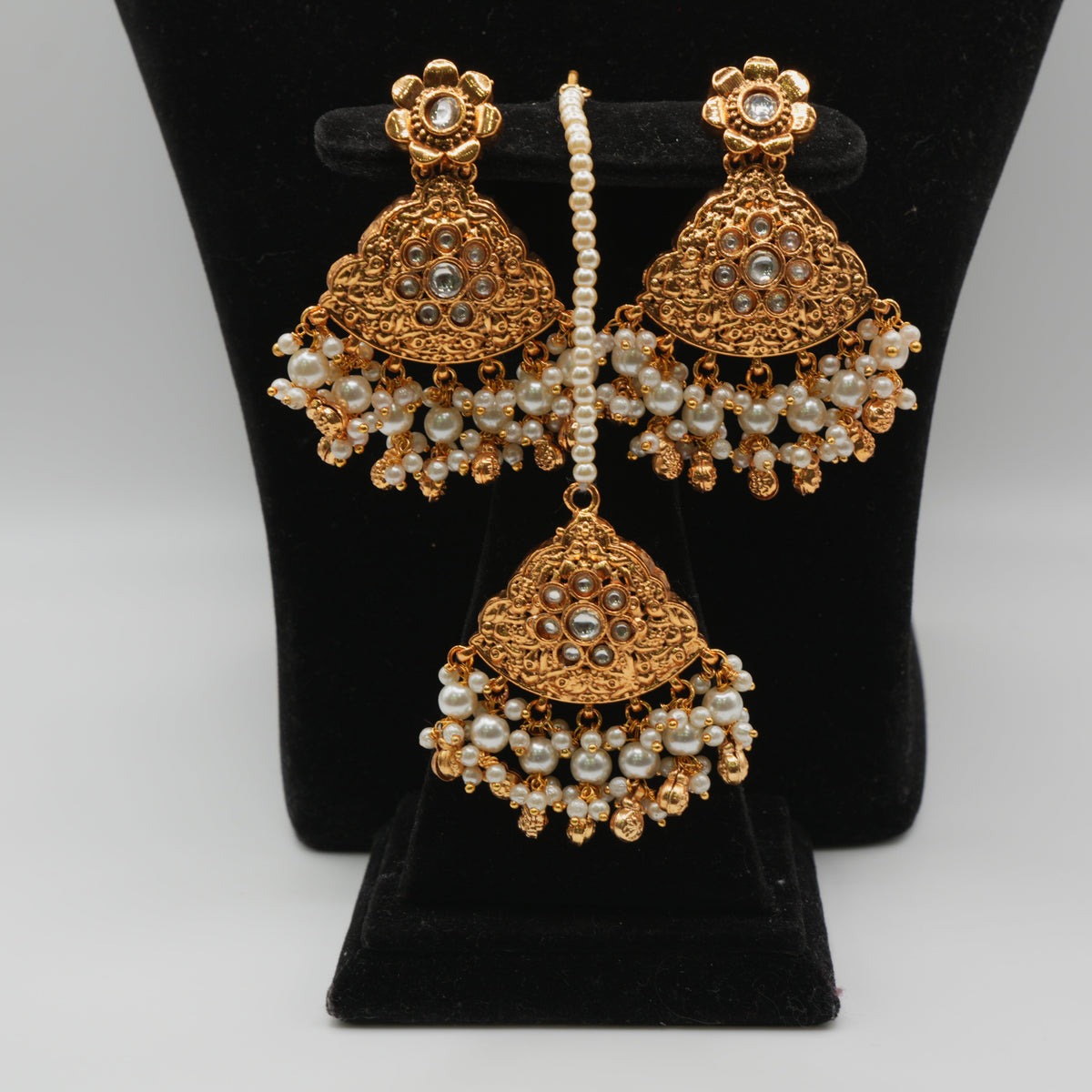 Parveen Pearl-Strand Kundan Set — gold plated pearl strand choker with triangular temple pendant with clear kundan stones and pearl cluster drops, matching chandbali earrings and triangular maang tikka