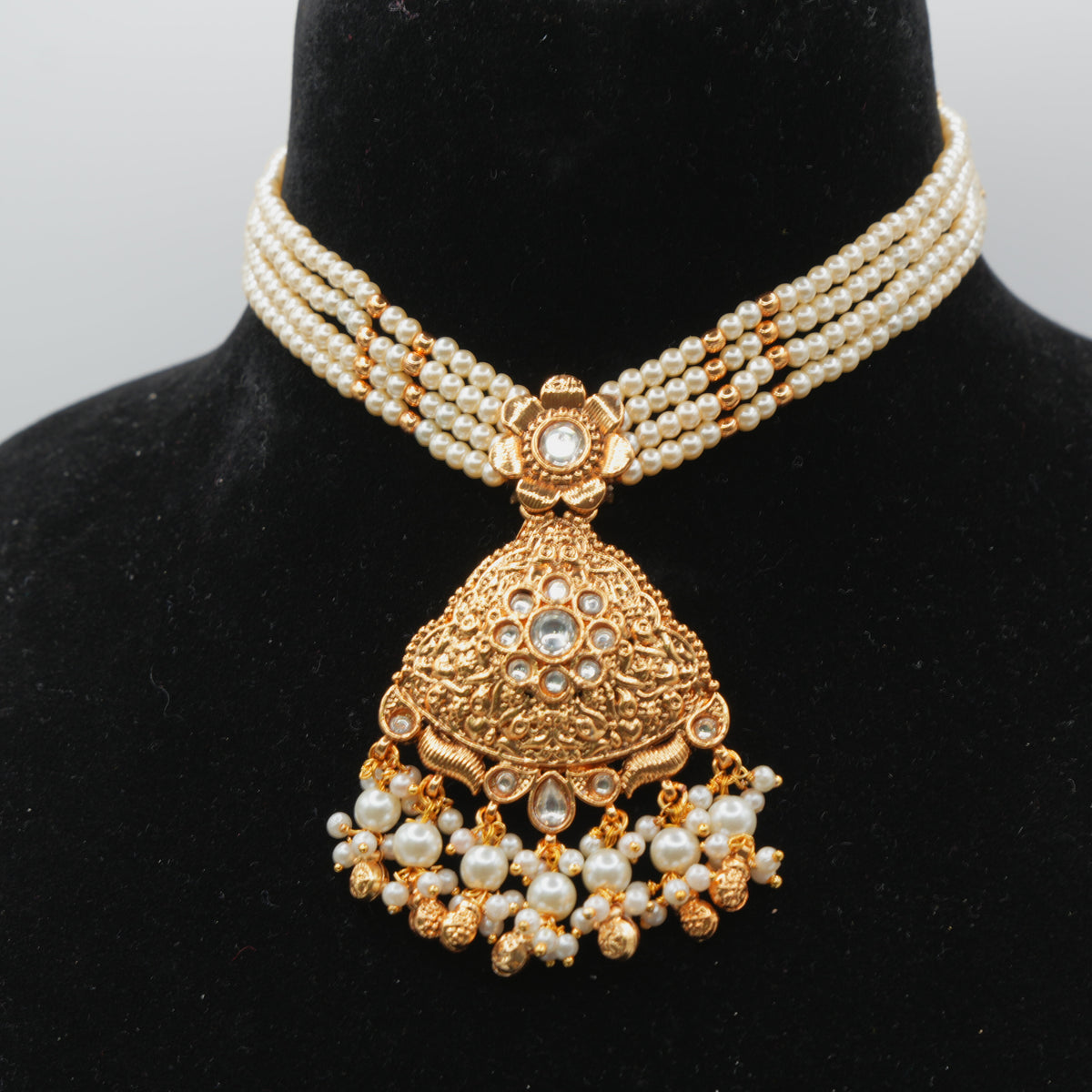 Parveen Pearl-Strand Kundan Set — gold plated pearl strand choker with triangular temple pendant with clear kundan stones and pearl cluster drops, matching chandbali earrings and triangular maang tikka
