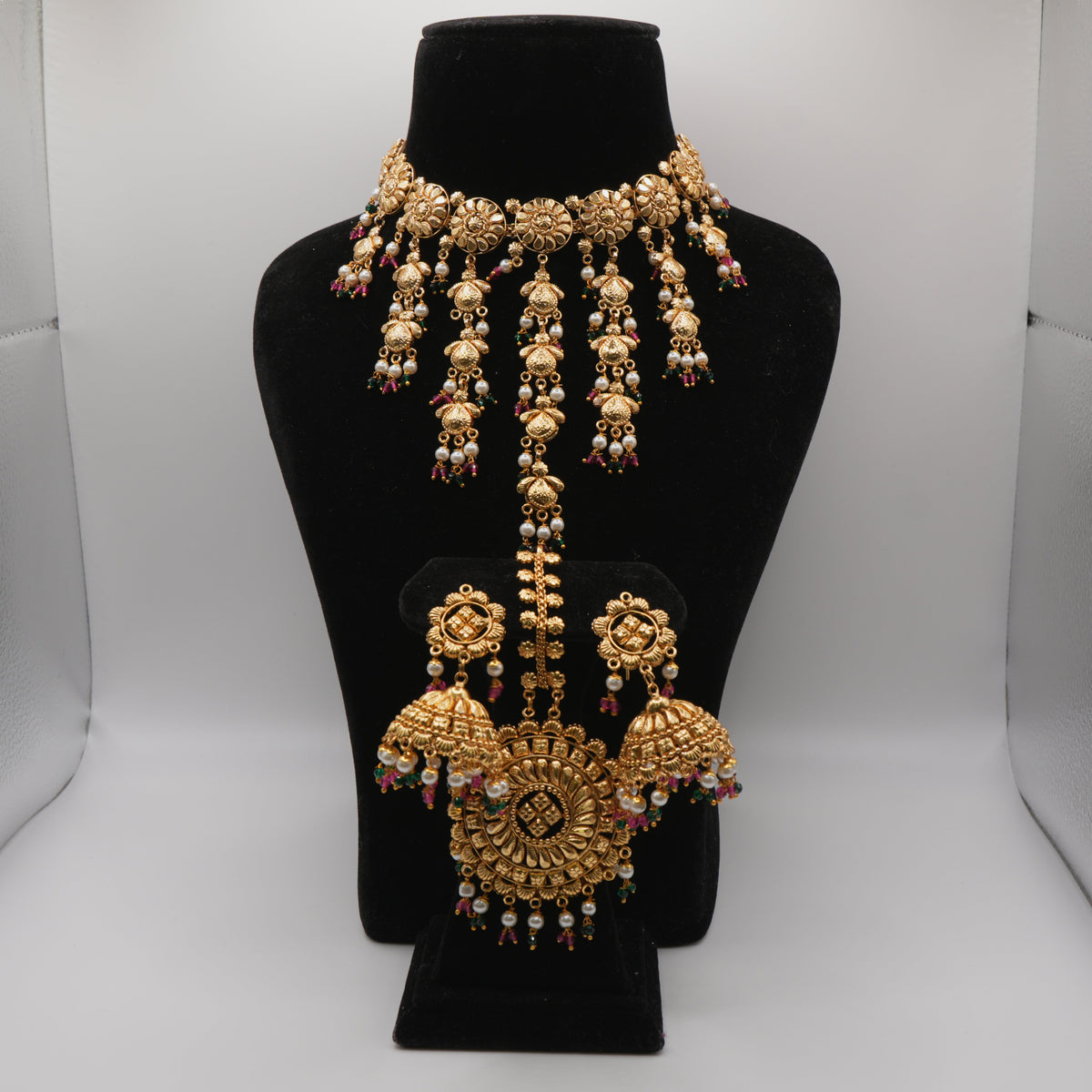 Rani Jhumki Medallion Set — gold plated medallion choker necklace with pearl tassels, ruby and emerald bead accents, jhumka earrings and jhumki-drop maang tikka
