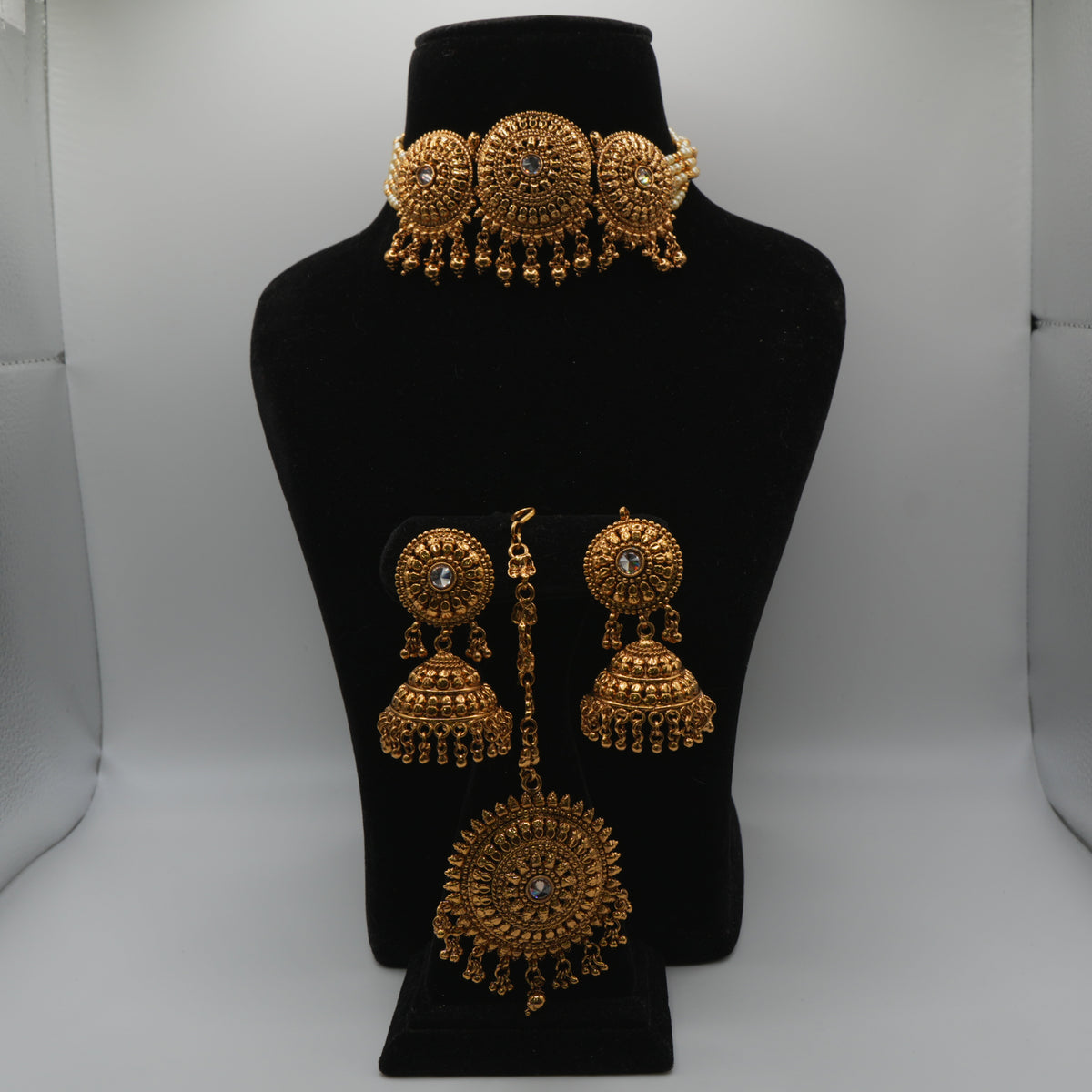 Saira Medallion Trio Choker Set — gold plated three-medallion choker necklace with pearl strands, matching jhumka earrings and statement maang tikka