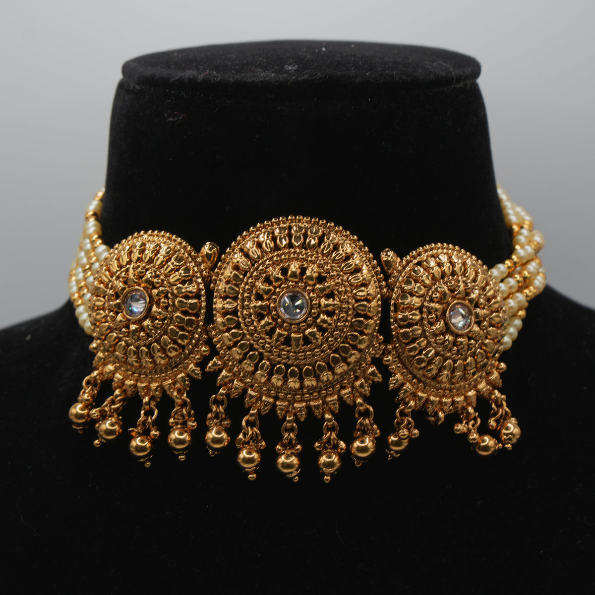 Saira Medallion Trio Choker Set — gold plated three-medallion choker necklace with pearl strands, matching jhumka earrings and statement maang tikka